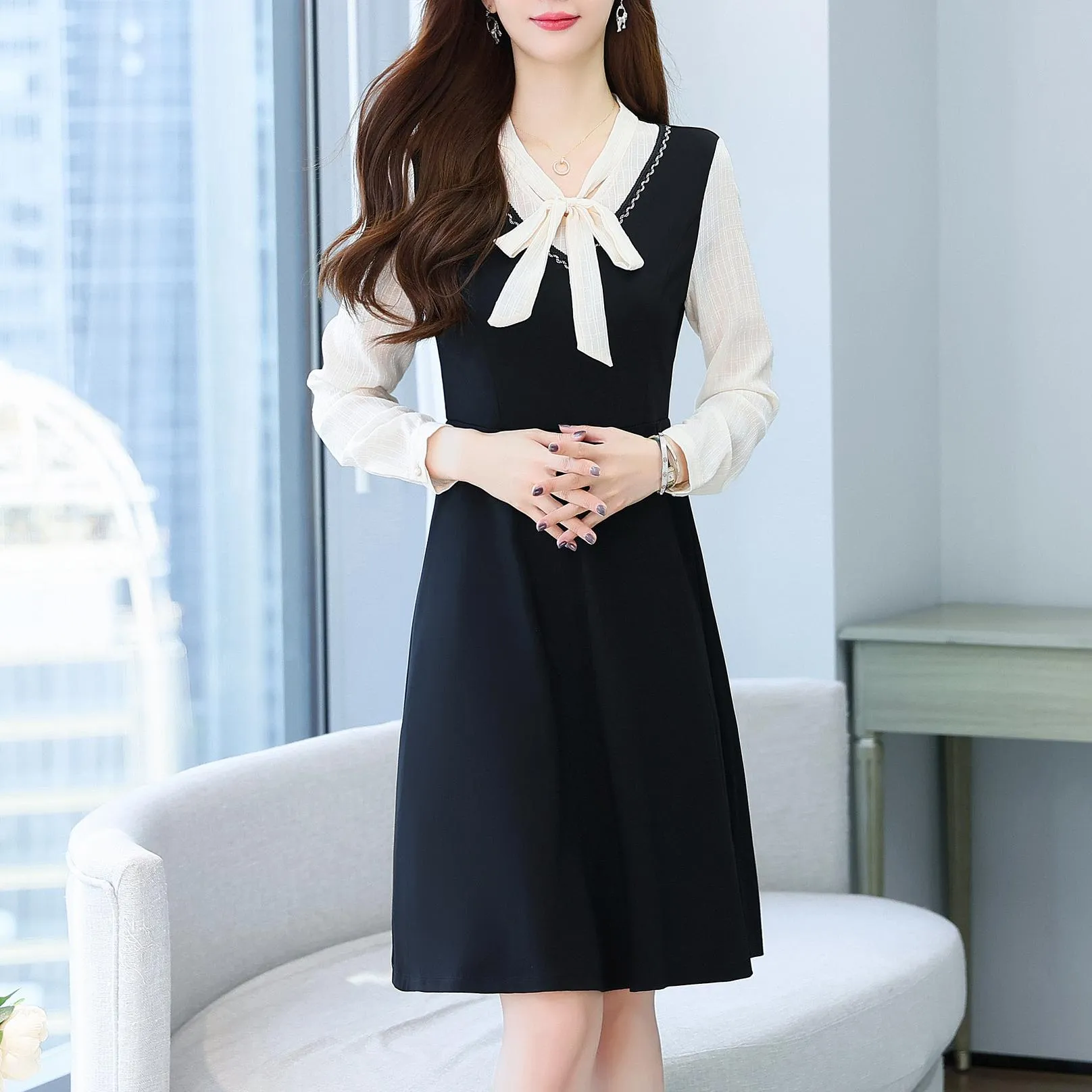 Elegantly Designed Women's Long Sleeve Tea Dress with Thigh-Length Cut