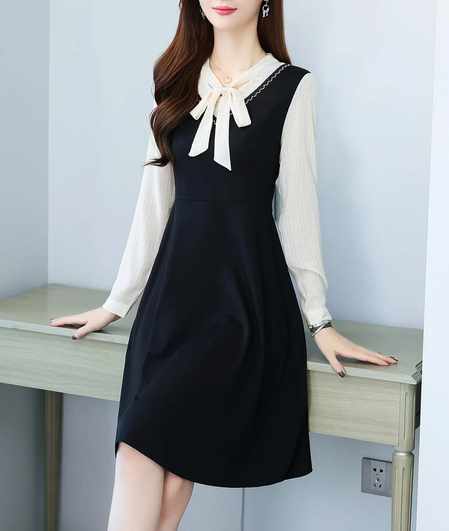 Elegantly Designed Women's Long Sleeve Tea Dress with Thigh-Length Cut